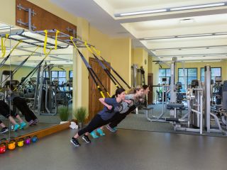 Three women in a TRX workout at The Lodge at Woodloch