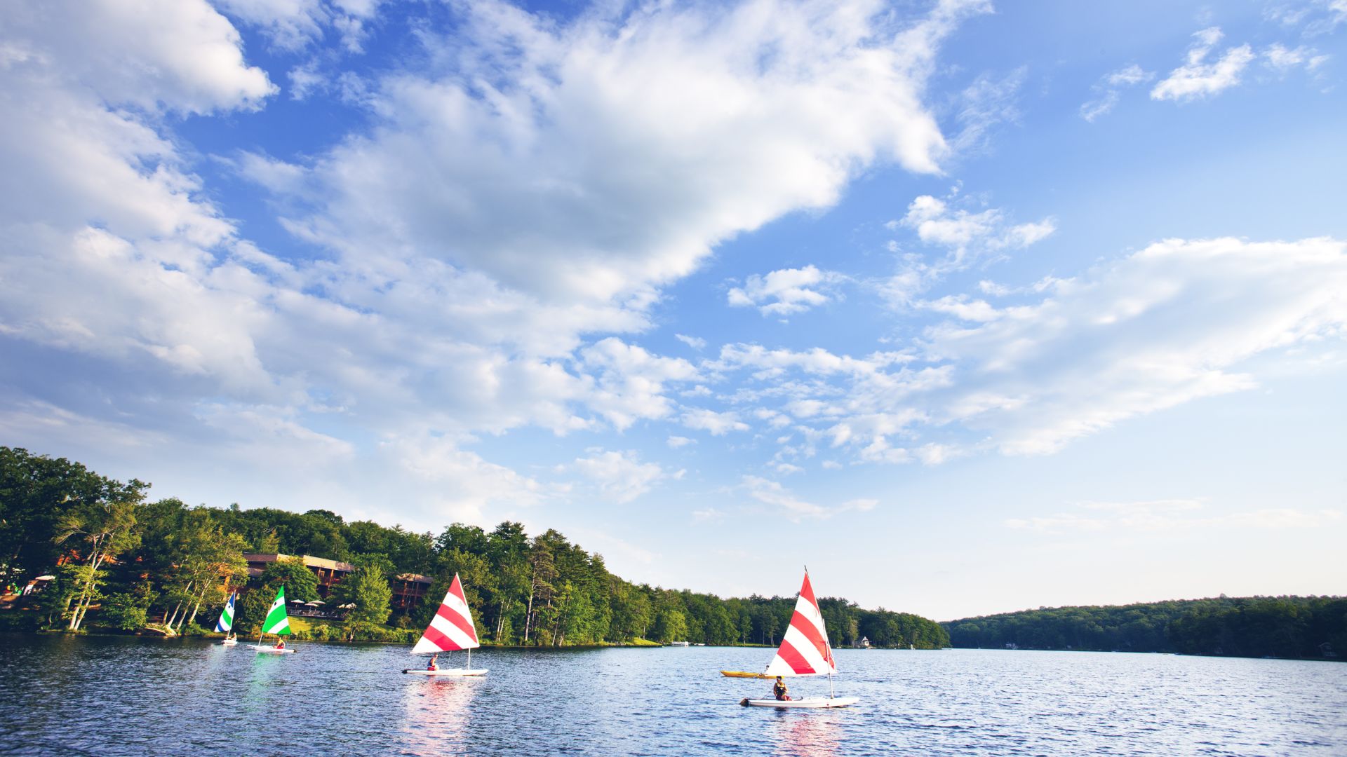 Two sailboats on the lake at Woodloch Pines Family Resort